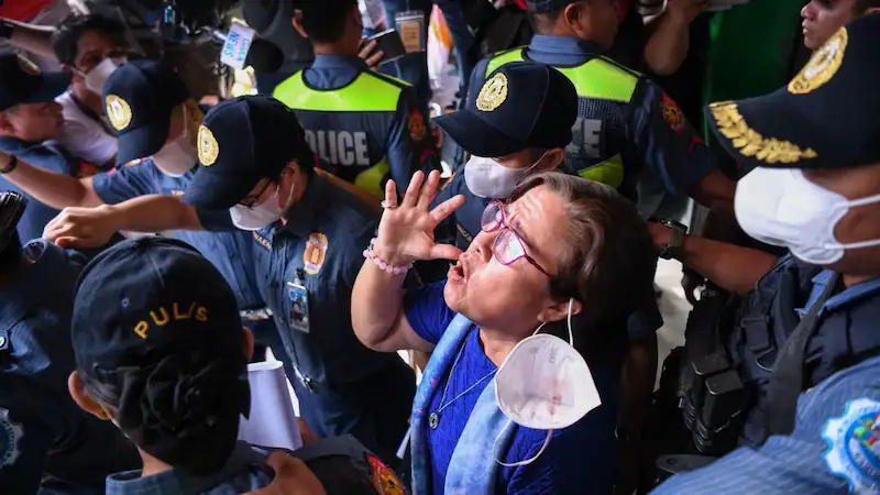 Philippine court drops drug case against outspoken opponent of former president's anti-drug campaign.