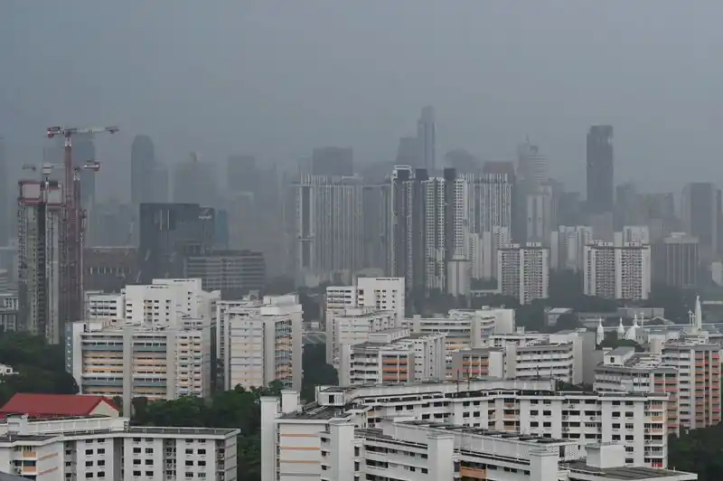 Singapore urges citizens to stock up on face masks due to impending threat of haze.