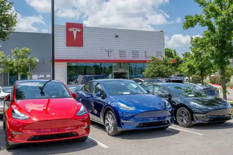Tesla benefits from $1.8 billion windfall in Biden's IRA amidst price war.