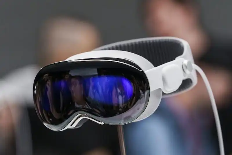Apple reduces Vision Pro targets due to production challenges, reports FT.
